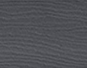 Dark gray textured surface with subtle horizontal ridges or waves.