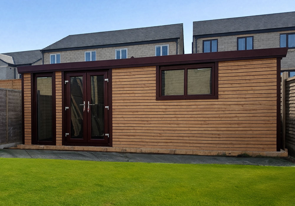Wooden garden shed with dark brown trim and double-glazed glass doors, set on a paved base in a fenced backyard.