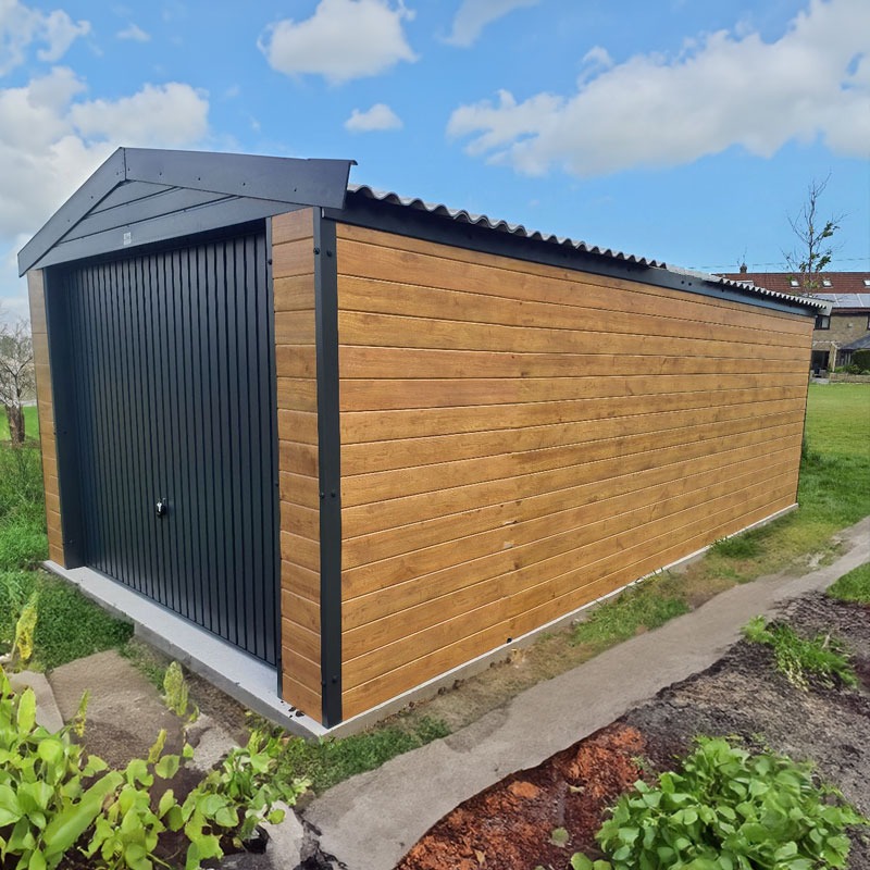 Wooden garden shed with black metal door and corrugated roof on a sunny day in a grassy yard.